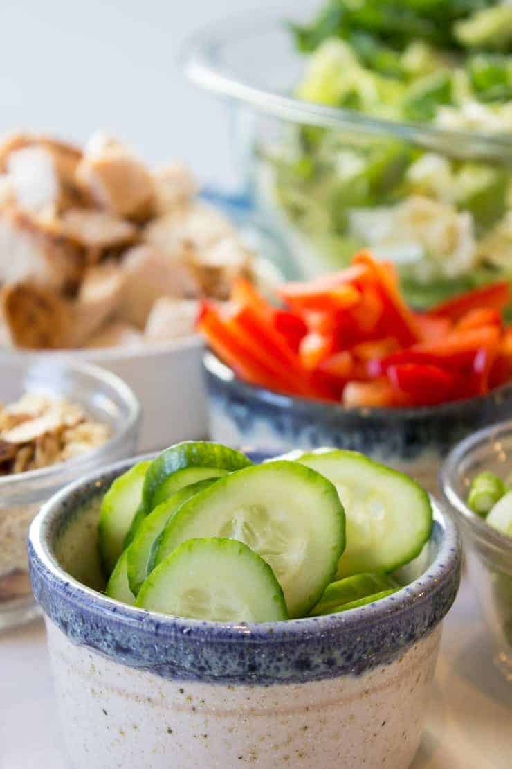 Salad ingredients chopped and in small bowls.