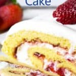 A rolled white cake filled with sliced strawberries and whipped cream.