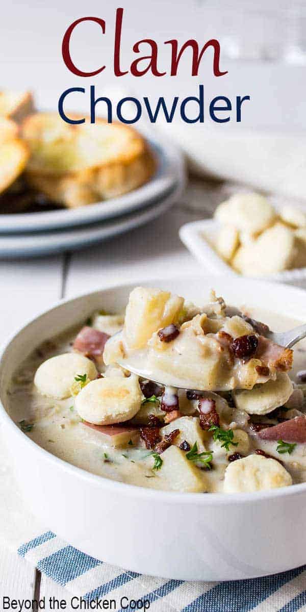 A white bowl filled with new england clam chowder