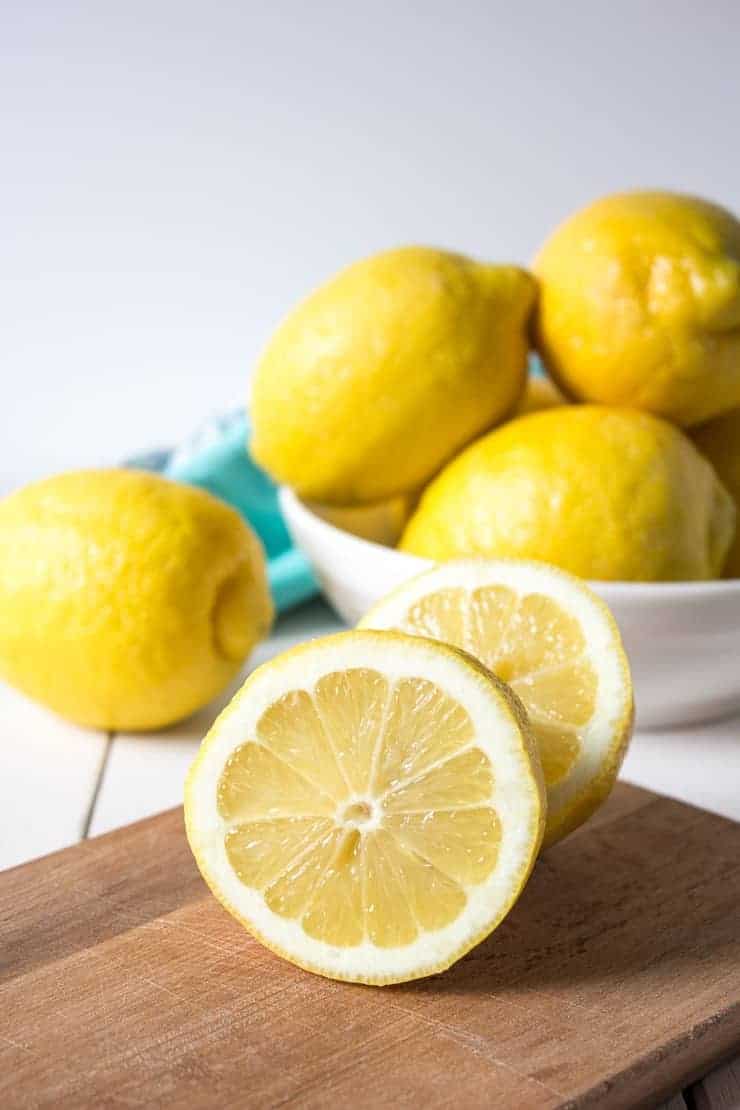 Fresh lemons on a board. 