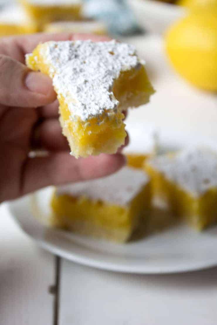 A bite out of a lemon dessert. 