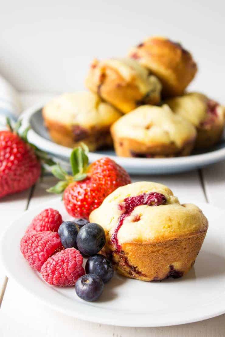 Homemade Triple Berry Muffins are filled with strawberries, raspberries and blueberries.