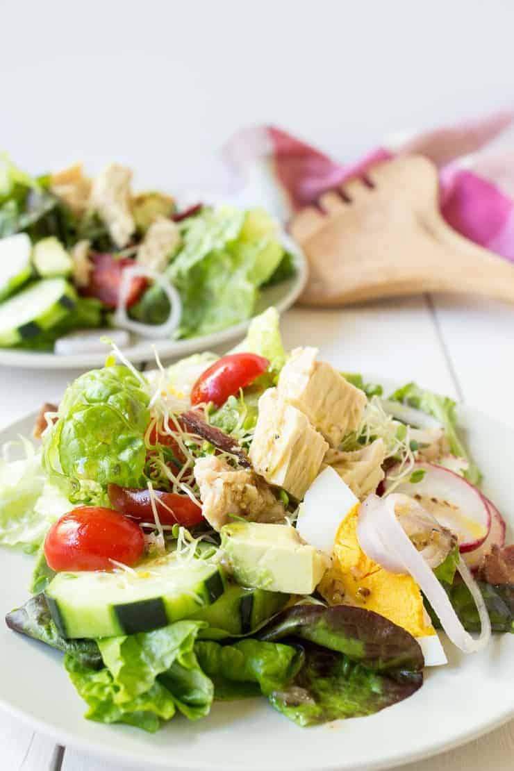 Cobb salad made with tuna and topped with a light vinaigrette dressing