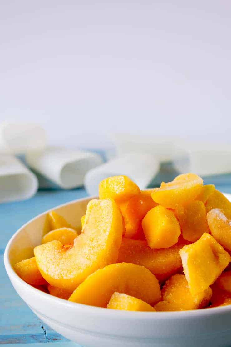 Ingredients for Mango Peach Popsciles! Frozen mangoes and peaches.