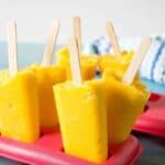 Super healthy and super delicious, Mango Peach Popsicles! Nothing but pure fruit!