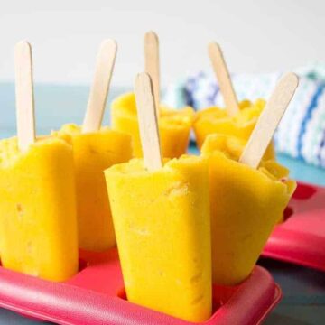 Super healthy and super delicious, Mango Peach Popsicles! Nothing but pure fruit!