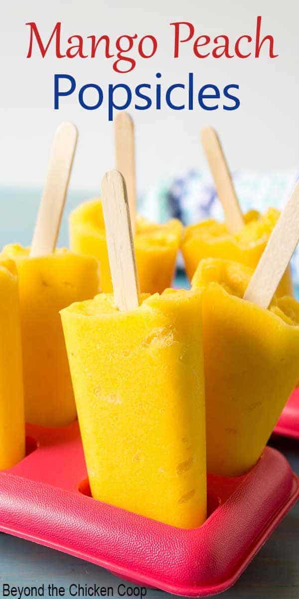 Bright yellow popsicles with wooden sticks.
