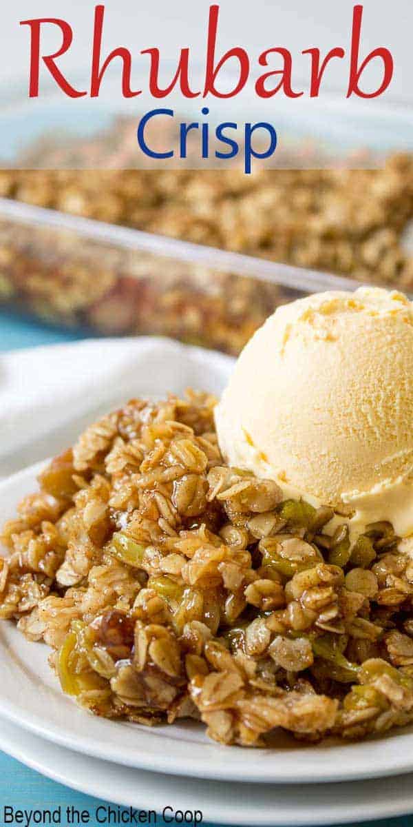 A scoop of vanilla ice cream on top of a rhubarb crisp. 