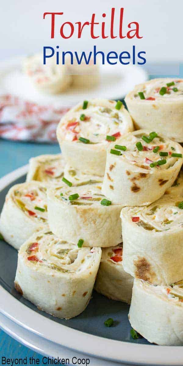 Cream cheese pinwheels on a blue and white plate.