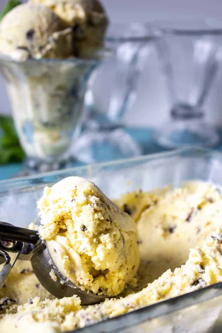 A scoop of ice cream filled with chocolate chips.