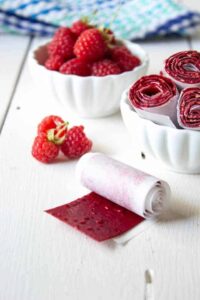 Fresh raspberries turned into delicious and healthy Raspberry Fruit Roll Ups.