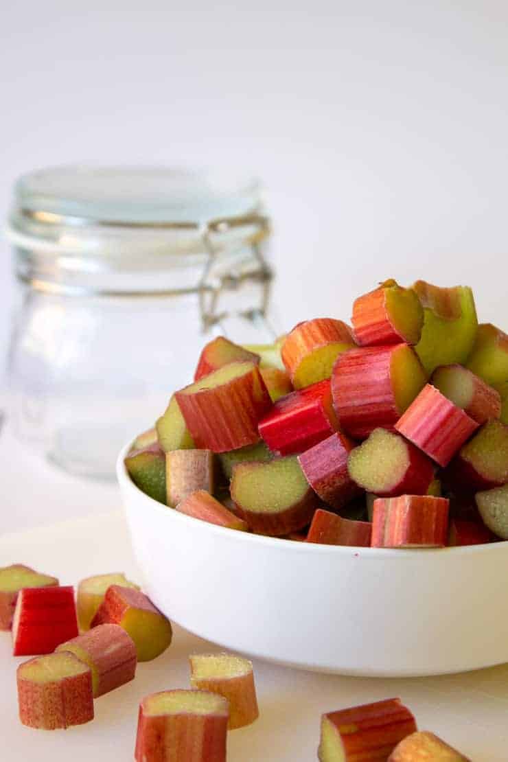 Cut rhubarb for in a white bowl.