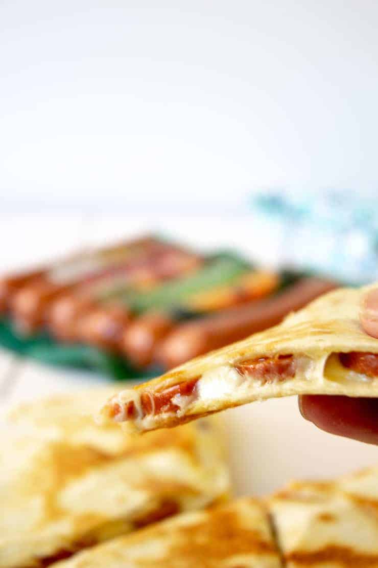 A slice of smoked sausage quesadilla