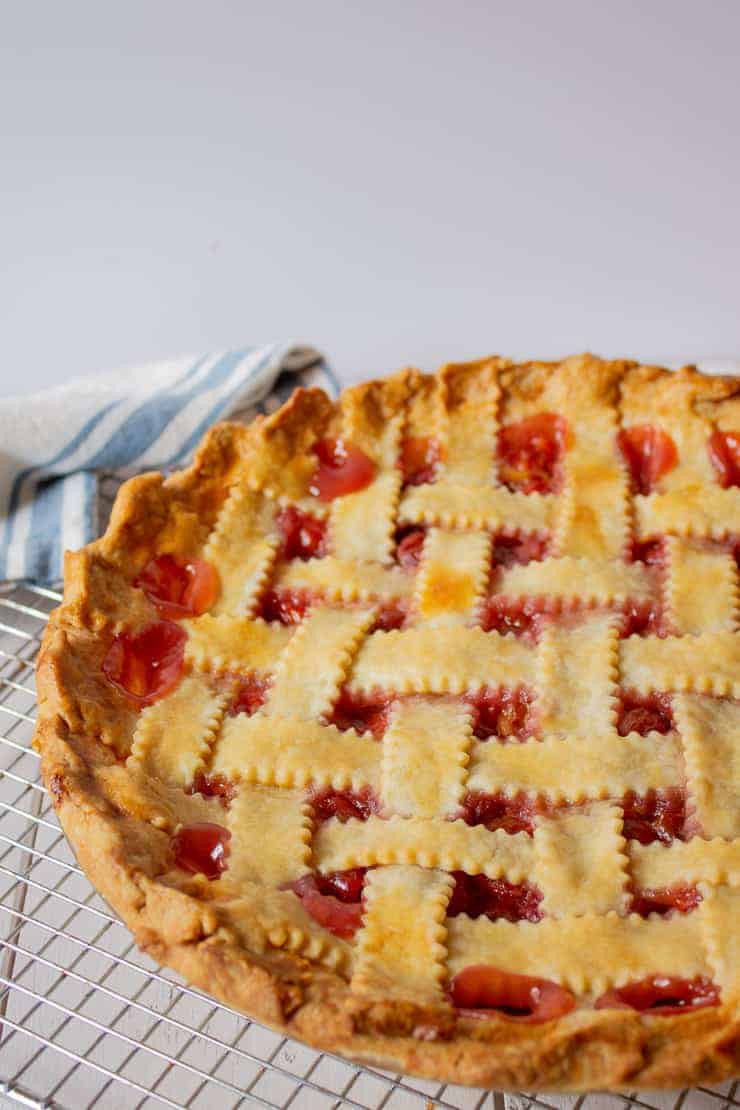 Homemade Cherry Pie on a baking rack.