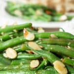 Fresh green beans topped with sliced almonds.