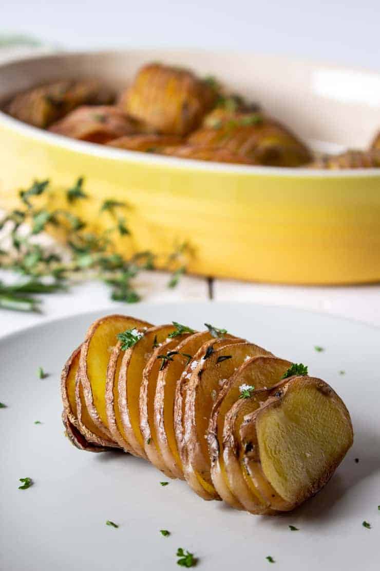 Roasted Hasselback Potatoes with fresh thyme, rosemary and salt.