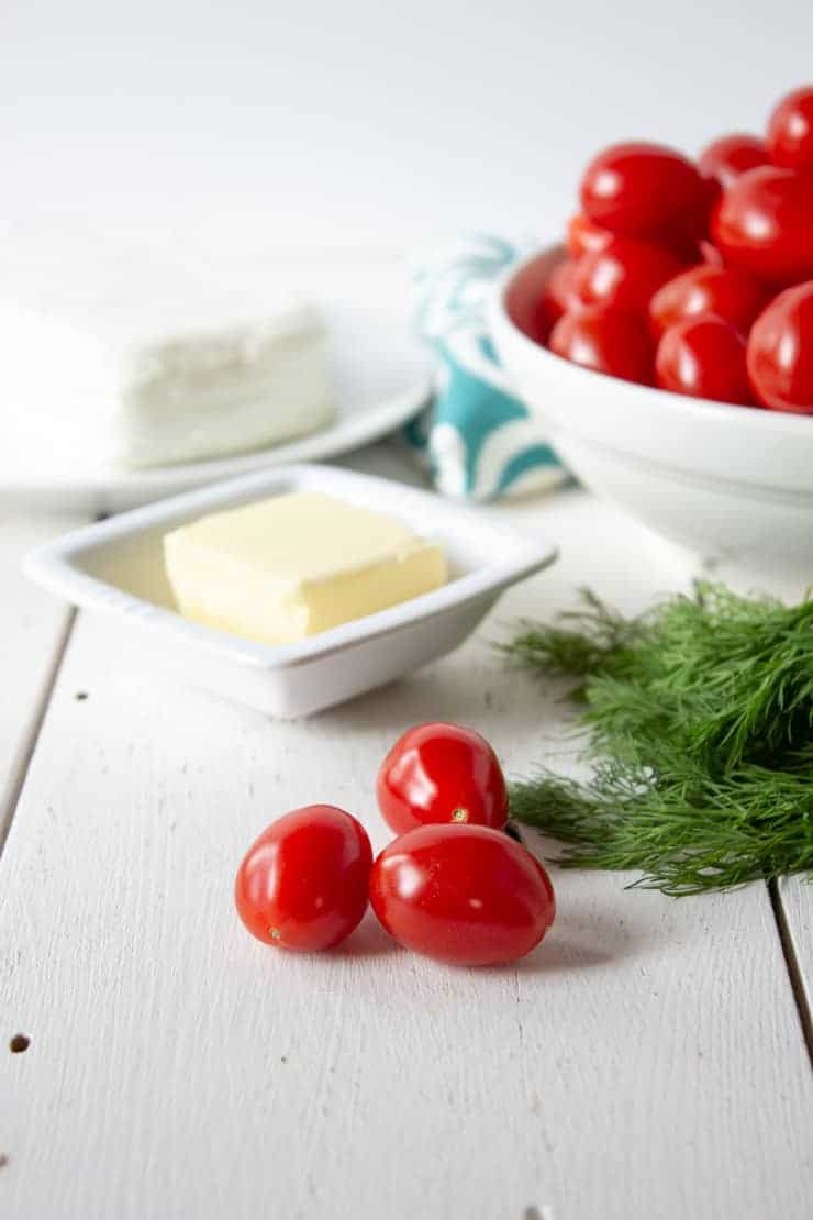 Ingredients needed for making stuffed cherry tomatoes.