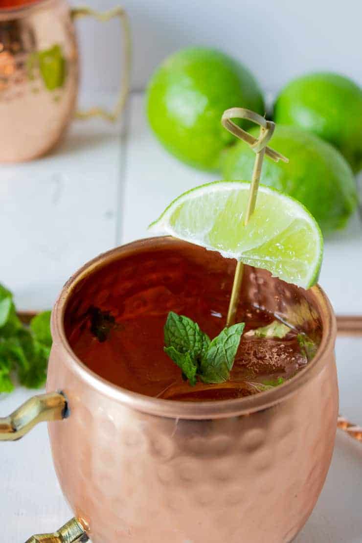 A copper mug filled with a Moscow Mule made with ginger ale