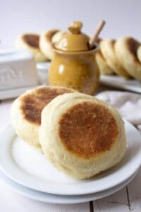 Two Sourdough English Muffins on a plate.