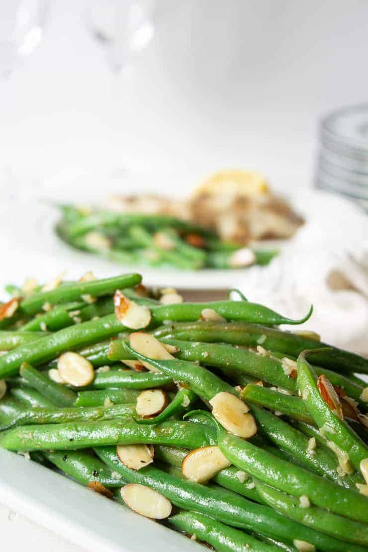 Green bean almondine topped with toasted almonds.