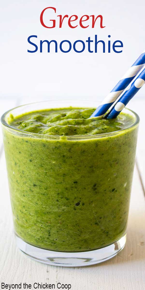 A glass filled with a bright green drink.