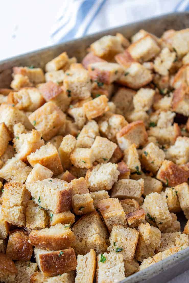 Bread cubes in a pan for making homemade croutons.
