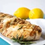 Lemon Rosemary Grilled chicken on a white plate