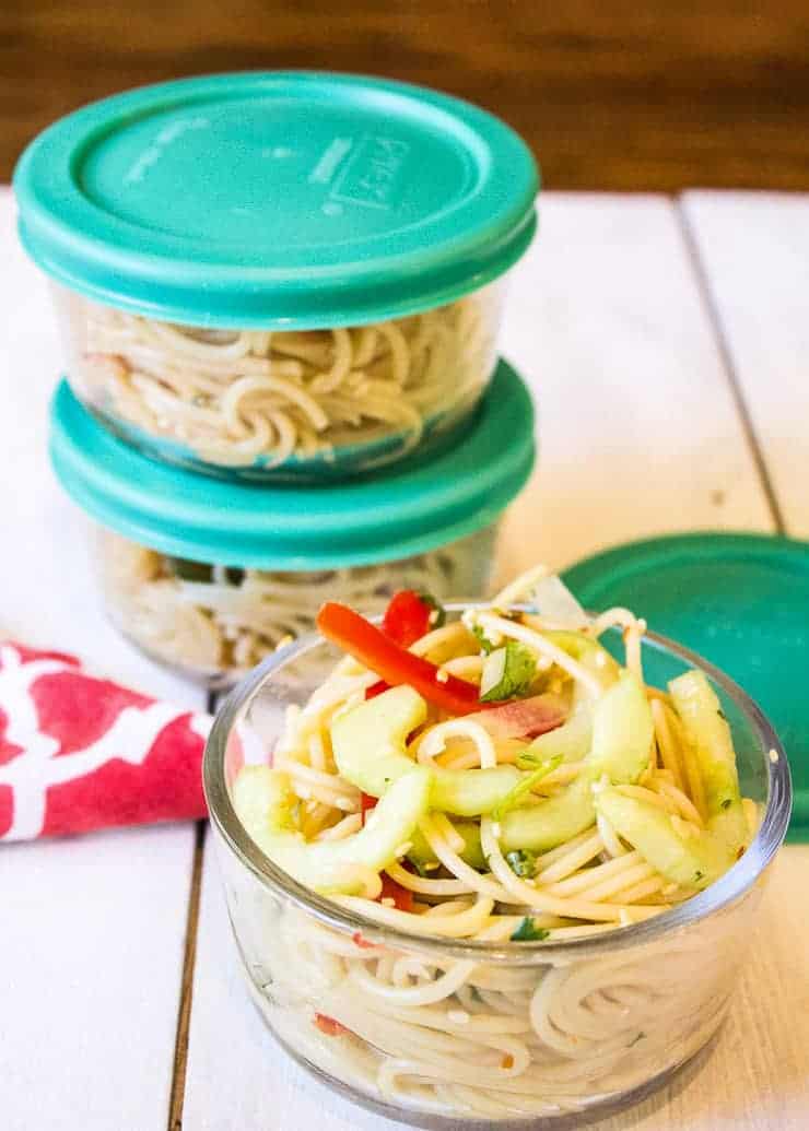 Pasta salad in small glass containers.