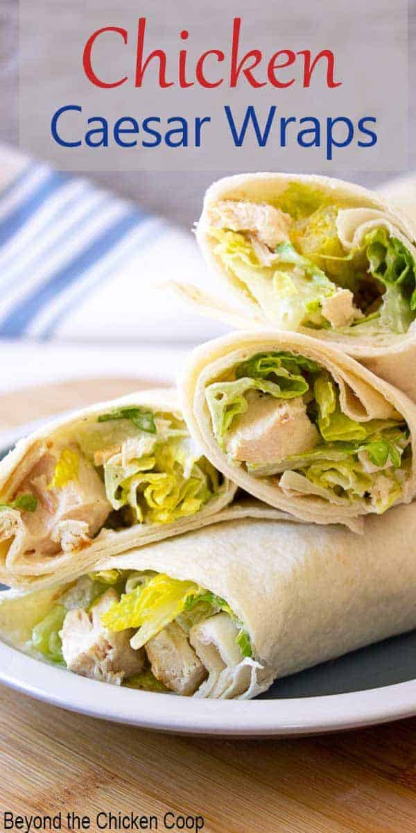 Tortillas wrapped around chicken and caesar salad.