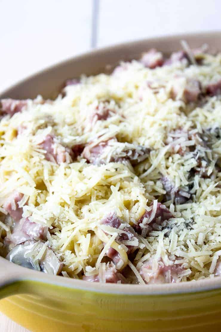 Unbaked Ham Tetrazzini topped with parmesan cheese