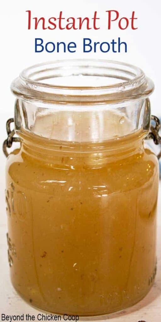 An old jar filled with a golden broth.