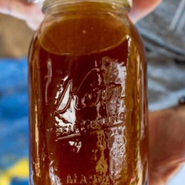 A canning jar filled with freshly spun honey.