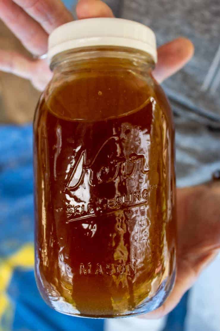 A canning jar filled with freshly spun honey.