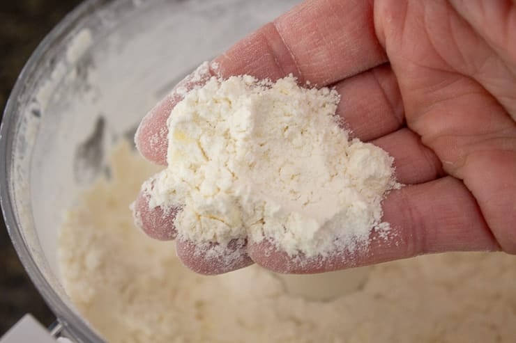 Coarse flour mixture on a hand.