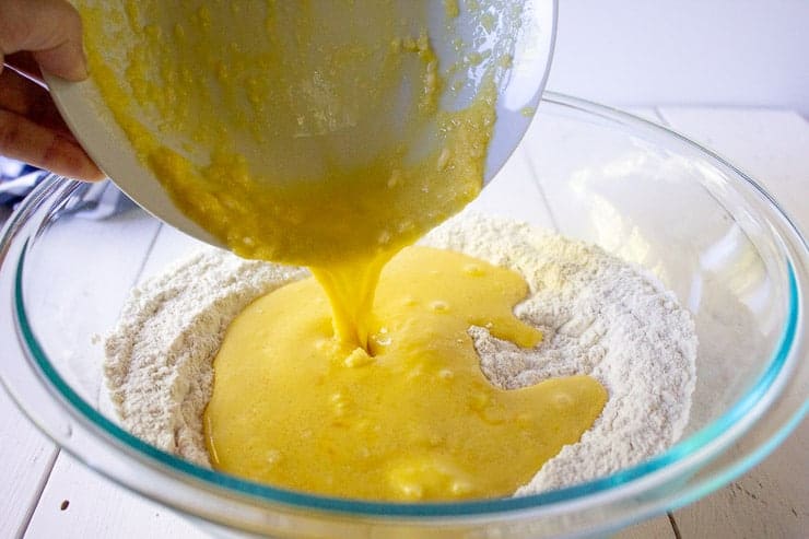 Egg mixture being added to a flour mixture.