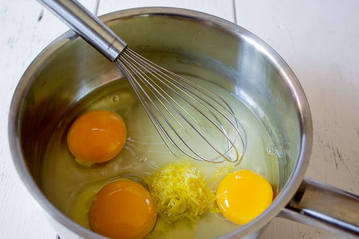 Eggs, sugar and lemon zest in a sauce pan.