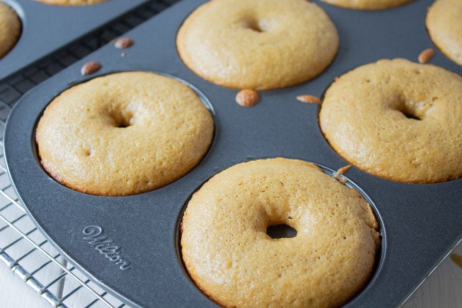 Cooked donuts in a pan.