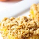 Peach bar with chunks of peaches and a crumb topping.