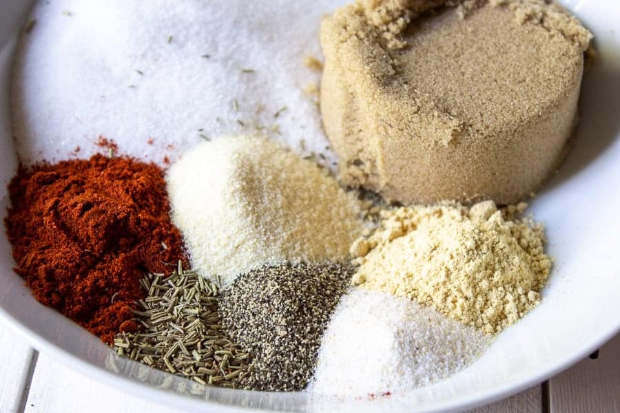 Sugar and spices in a white bowl. 