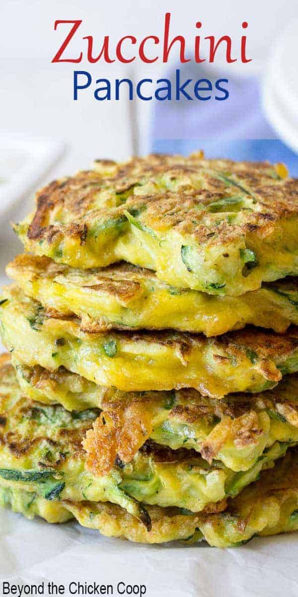 A stack of zucchini fritters with cheese. 