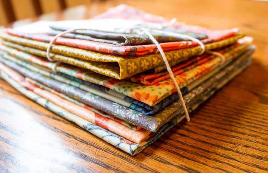 A stack of colored beeswax covered fabric.