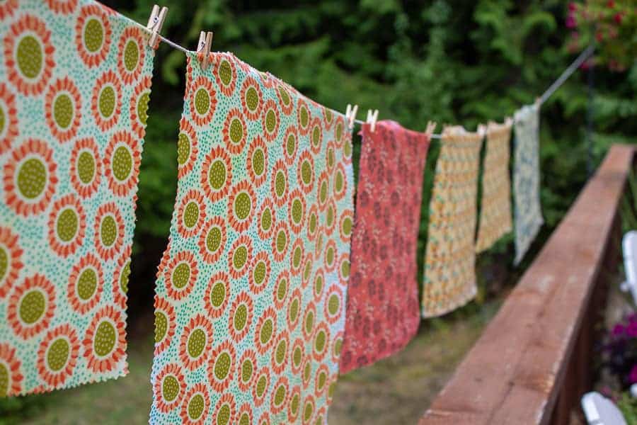 Beeswax Wraps hanging from a line.