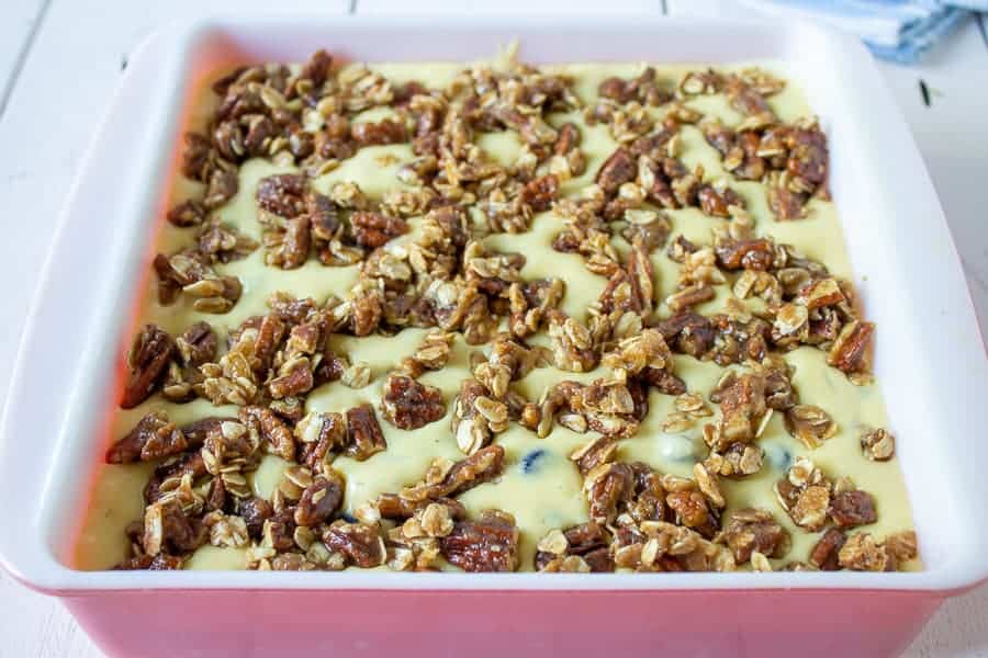 Uncooked coffee cake in a baking dish.