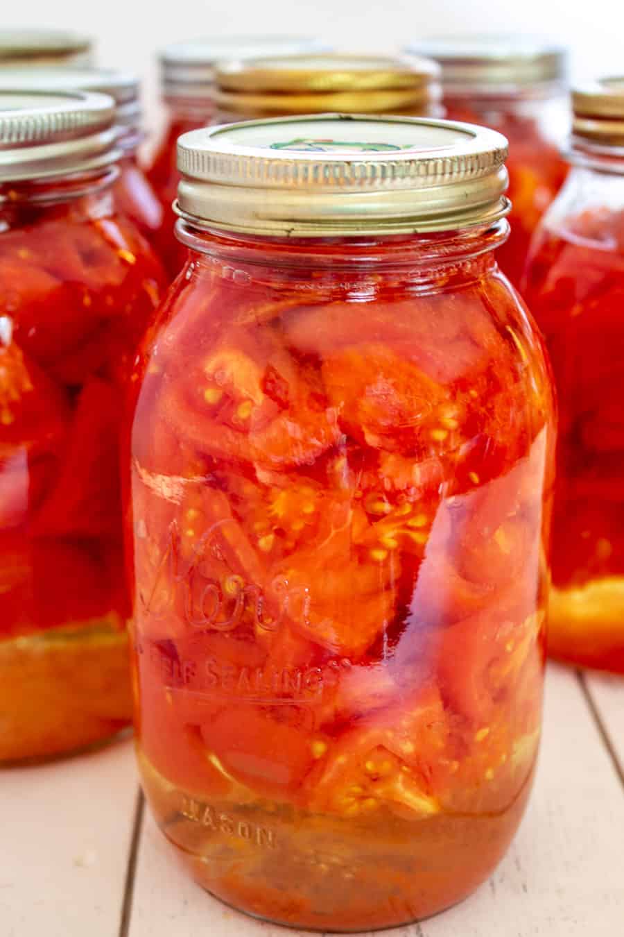 Chopped tomatoes in a glass jar. 