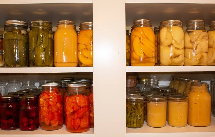 A pantry filled with canned goods.