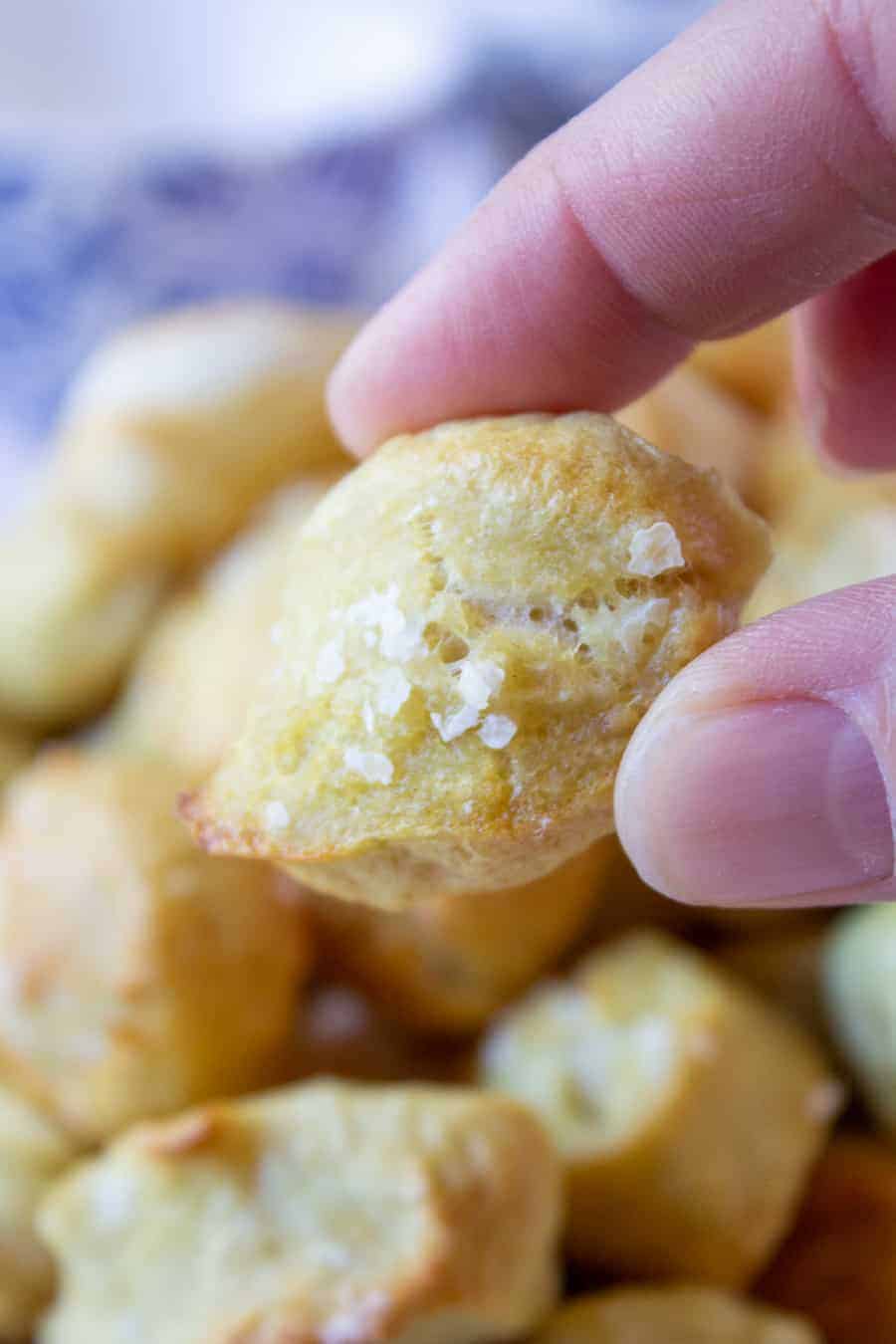 Close up of a pretzel bite with coarse salt.