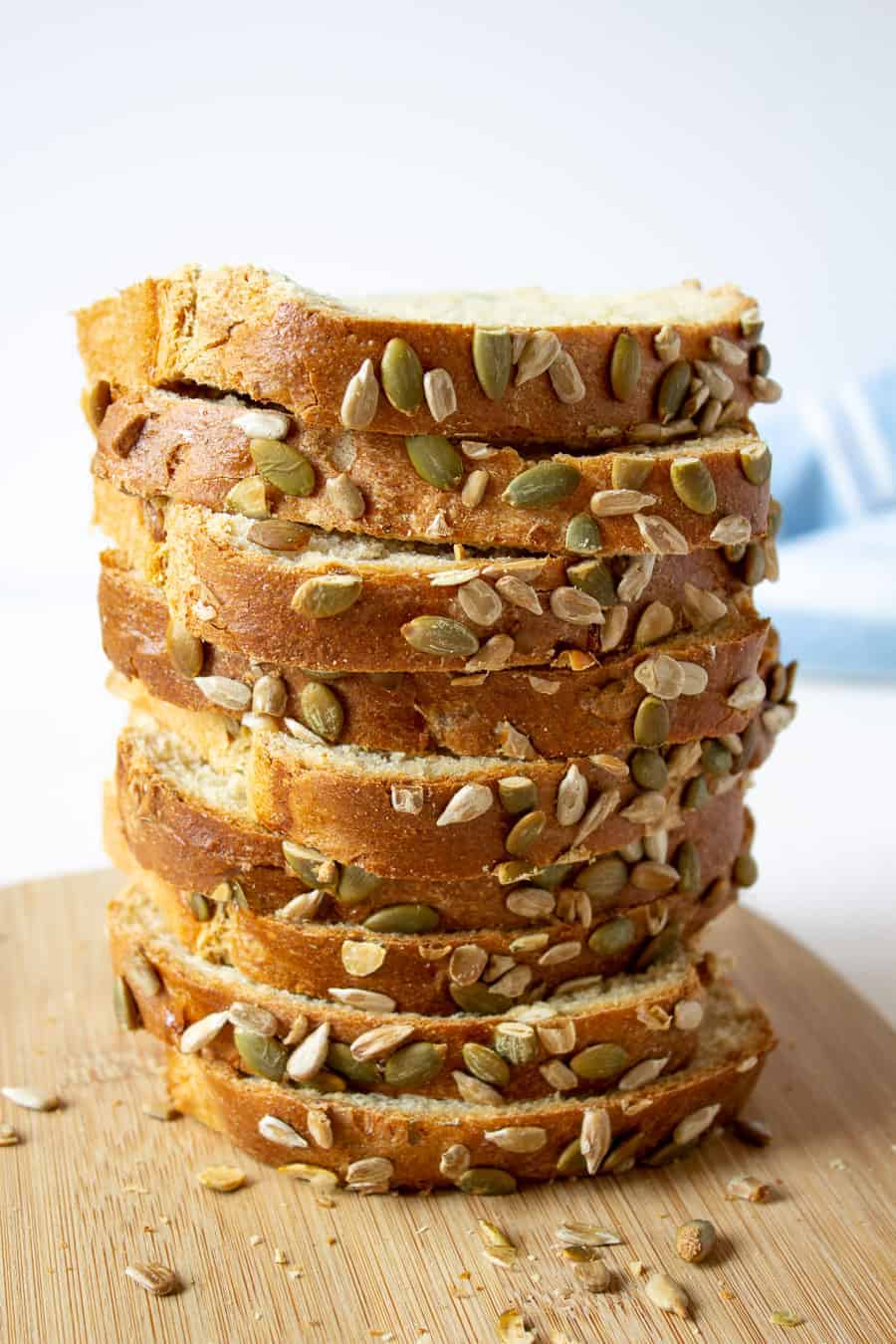 A stack of sliced bread with pumpkin seeds.