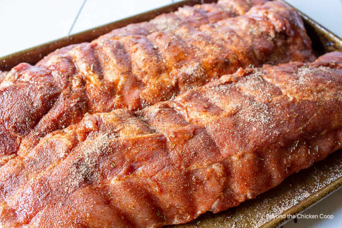 A dry rub on baby back ribs.