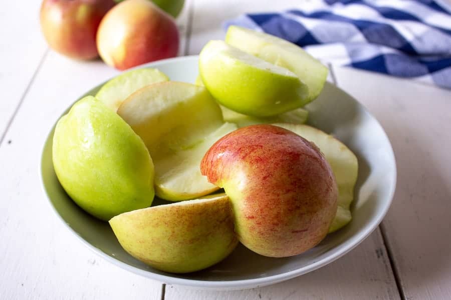 A bowlful of green and red apples.