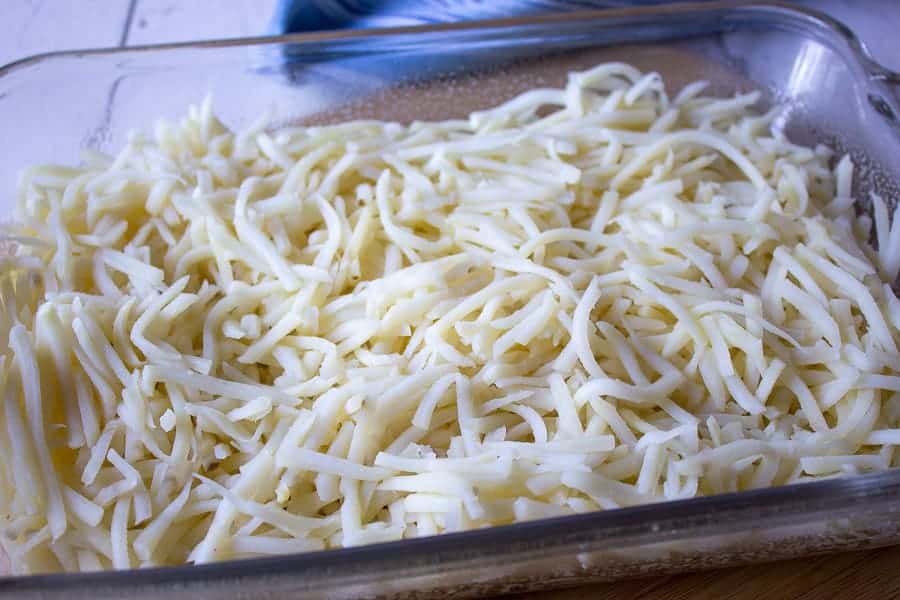Hash browns in a glass baking dish. 